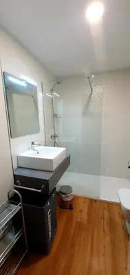 a bathroom with a white sink and a mirror at Guesting Barrocal in Cádiz