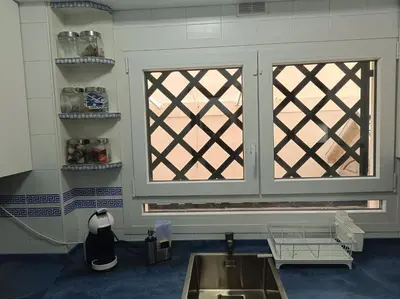 a kitchen with a sink and a window at Apartment Huerta del Obispo in Cádiz
