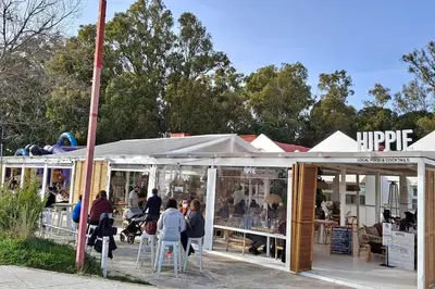a group of people standing outside of a store at Casa con encanto junto a la playa de La Puntilla in El Puerto de Santa María