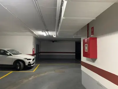 a parking garage with a white car parked in it at Estudio Alameda in Cádiz