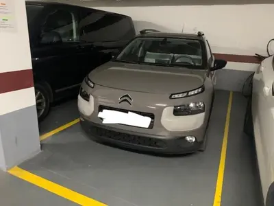 a small car is parked in a garage at Estudio Alameda in Cádiz