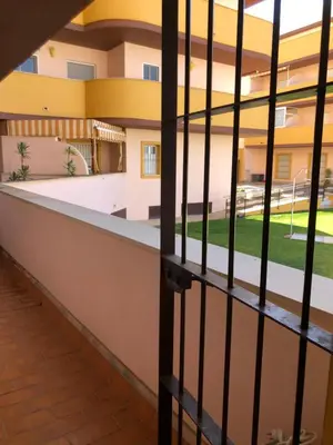 a view of the outside of a building through a gate at Terraza Mirador del Coto in Sanlúcar de Barrameda
