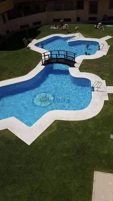 an overhead view of a swimming pool in the grass at Terraza Mirador del Coto in Sanlúcar de Barrameda