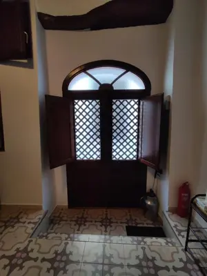 an open door with a window in a room at CASA MONTAÑA in Arcos de la Frontera