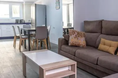 a living room with a couch and a table at Brisa Marinera Grupo AC Gestion in Cádiz