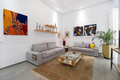 a living room with two couches and a coffee table at Precioso alojamiento en Cádiz junto al mercado in Cádiz