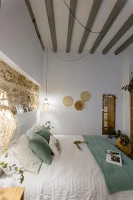 a bedroom with a large bed in a room at Pitusa Home in Cádiz