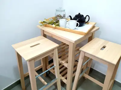 a small table and two stools with cups on it at Sherryflat C/ Arcos in Jerez de la Frontera