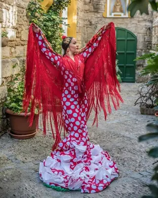 a woman in a red dress with wings at Sherryflat C/ Arcos in Jerez de la Frontera