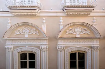 two doors on the side of a building at Áurea Casa Palacio Sagasta by Eurostars Hotel Company in Cádiz