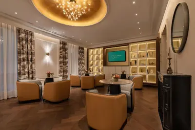 a dressing room with tables and chairs and a tv at Áurea Casa Palacio Sagasta by Eurostars Hotel Company in Cádiz