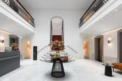 a lobby with a table with food on it at Áurea Casa Palacio Sagasta by Eurostars Hotel Company in Cádiz