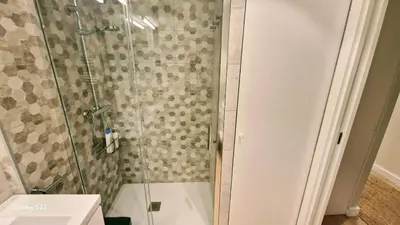 a shower with a glass door in a bathroom at Boutelou playa con vistas al mar in Sanlúcar de Barrameda