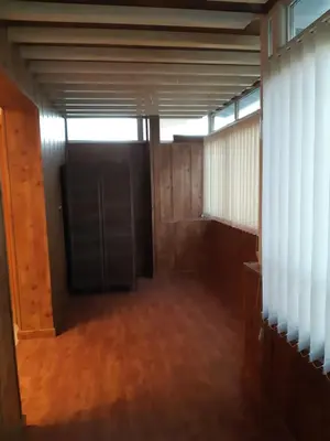 an empty room with a black door in a building at Casa Grande Zona Norte in Jerez de la Frontera