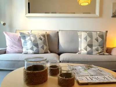 a living room with a couch and a coffee table at Sherryflat Neira - Parking in Jerez de la Frontera