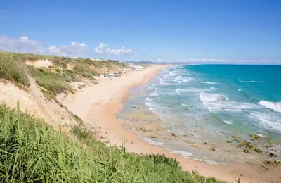 a view of a beach with the ocean at Casa moderna, piscina, playa, TV75, Netflix, PS4 in Conil de la Frontera