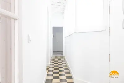 a hallway with a black and white checkered floor at La Casa del Alfarero by Cadiz Time in Cádiz