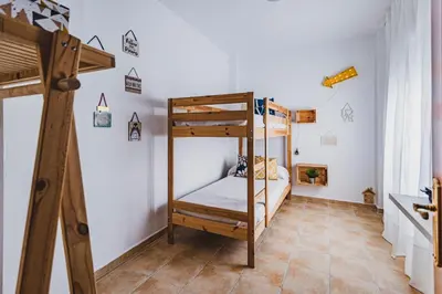 a bunk bed room with a bunk bed in a room at La casa de John Wine , Bornos (Spain) in Bornos