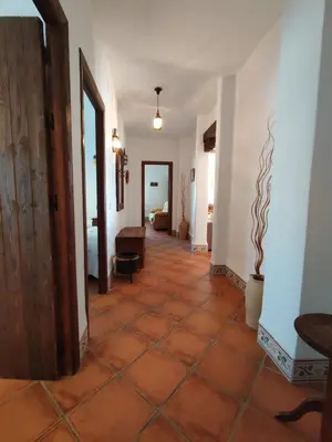 a hallway in a house with a tile floor at Casa Antonia in Conil de la Frontera