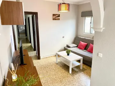 a living room with a couch and a table at Apartamentos turísticos en Jerez de la frontera in Jerez de la Frontera