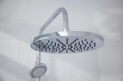 a shower with a metal shower head in a bathroom at Loft en el corazón de Cádiz con opción a Parking in Cádiz