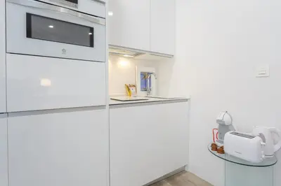 a kitchen with white cabinets and a white appliance at Apartamento El SEMINARISTA by Cadiz4Rentals in Cádiz