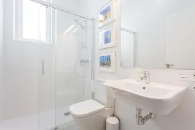 a bathroom with a sink and a toilet and a shower at Apartamento El SEMINARISTA by Cadiz4Rentals in Cádiz