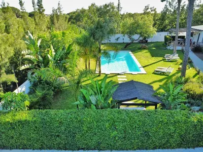 an aerial view of a garden with a swimming pool at VILLA OASIS | Casa Rural ideal Familias y grupos in Arcos de la Frontera