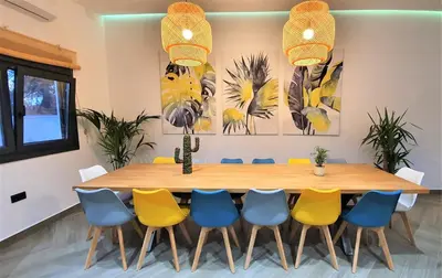 a conference room with a wooden table and chairs at VILLA OASIS | Casa Rural ideal Familias y grupos in Arcos de la Frontera