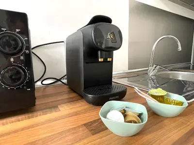 a coffee maker sitting on a counter next to a sink at No 5 Cádiz in Cádiz
