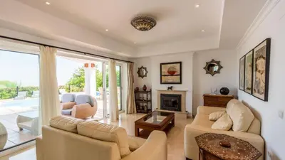 a living room with a couch and a fireplace at Villa Grazalema 1 - Villa 37 Arcos de la Frontera by Ruralidays in Arcos de la Frontera