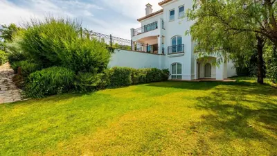 a large white house with a grass yard at Villa Grazalema 1 - Villa 37 Arcos de la Frontera by Ruralidays in Arcos de la Frontera