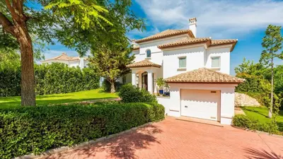 a white house with a garage at Villa Grazalema 1 - Villa 37 Arcos de la Frontera by Ruralidays in Arcos de la Frontera