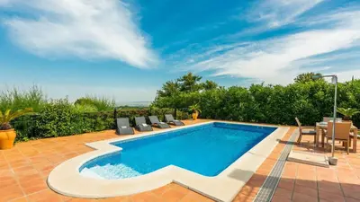 a swimming pool with chairs and a table at Villa Grazalema 1 - Villa 37 Arcos de la Frontera by Ruralidays in Arcos de la Frontera
