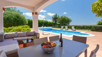 a patio with a table with a bowl of fruit on it at Villa Grazalema 2 - Villa 39 Arcos de la Frontera by Ruralidays in Arcos de la Frontera