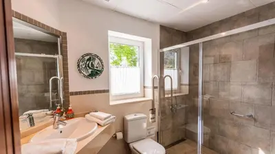 a bathroom with a sink and a shower and a toilet at Villa Grazalema 2 - Villa 39 Arcos de la Frontera by Ruralidays in Arcos de la Frontera