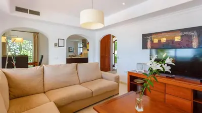 a living room with a couch and a tv at Villa Grazalema 2 - Villa 39 Arcos de la Frontera by Ruralidays in Arcos de la Frontera