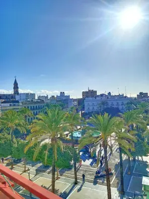 a view of a city with palm trees at Penthouse Arenal - Boutique Puerta Real in Jerez de la Frontera
