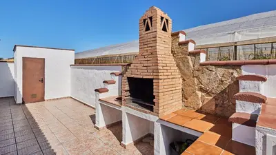 an outdoor brick oven on the side of a building at Casa Merce Conil de la Frontera by Ruralidays in Conil de la Frontera