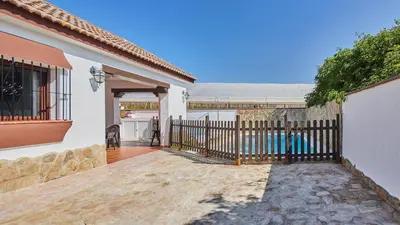 a gate to a house with a fence at Casa Merce Conil de la Frontera by Ruralidays in Conil de la Frontera