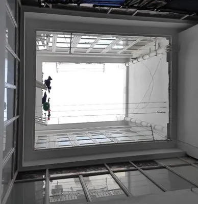 a person standing in front of a window at Apartamento Loft Puerto de Gades in Cádiz