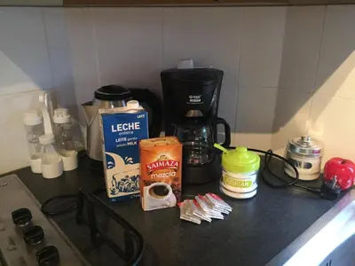 a counter top with a coffee maker and a coffee pot at Chiclana Mobile House - Piscina , Wi-Fi, Relax in Chiclana de la Frontera