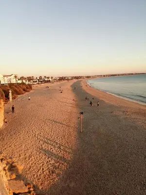 a view of a beach with people on it at Chiclana Mobile House - Piscina , Wi-Fi, Relax in Chiclana de la Frontera