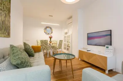 a living room with a couch and a table at El DESCANSO de San Antonio by Cadiz4Rentals in Cádiz