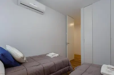 a bedroom with a bed and a mirror at El DESCANSO de San Antonio by Cadiz4Rentals in Cádiz