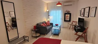 a living room with a couch and a table at El rincón de la Caleta in Cádiz