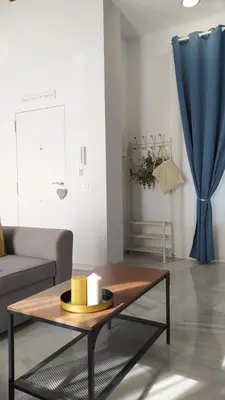 a living room with a couch and a coffee table at Sherryflat Teatro in Jerez de la Frontera