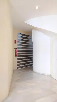 an empty room with a door in a building at Sherryflat Teatro in Jerez de la Frontera