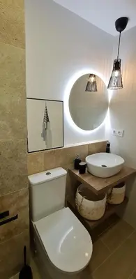 a bathroom with a white toilet and a sink at APTARTAMENTO DOÑANA RECIEN REFORMADO Parking gratis in Sanlúcar de Barrameda