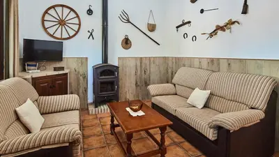 a living room with two couches and a table at Chalet El Cancelín Conil de la Frontera by Ruralidays in Conil de la Frontera